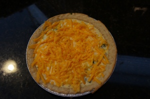 The quice pre-oven. Eggs and cheddar go over the bottom layer