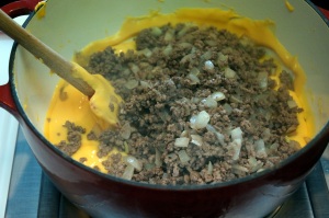 mixing the beef and cheese together
